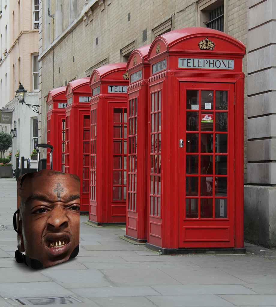 21 Savage in the UK next to a phone booth