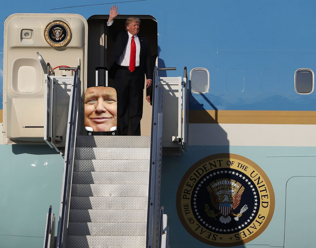 Donald Trump exiting an Airforce One jet with his luggage.